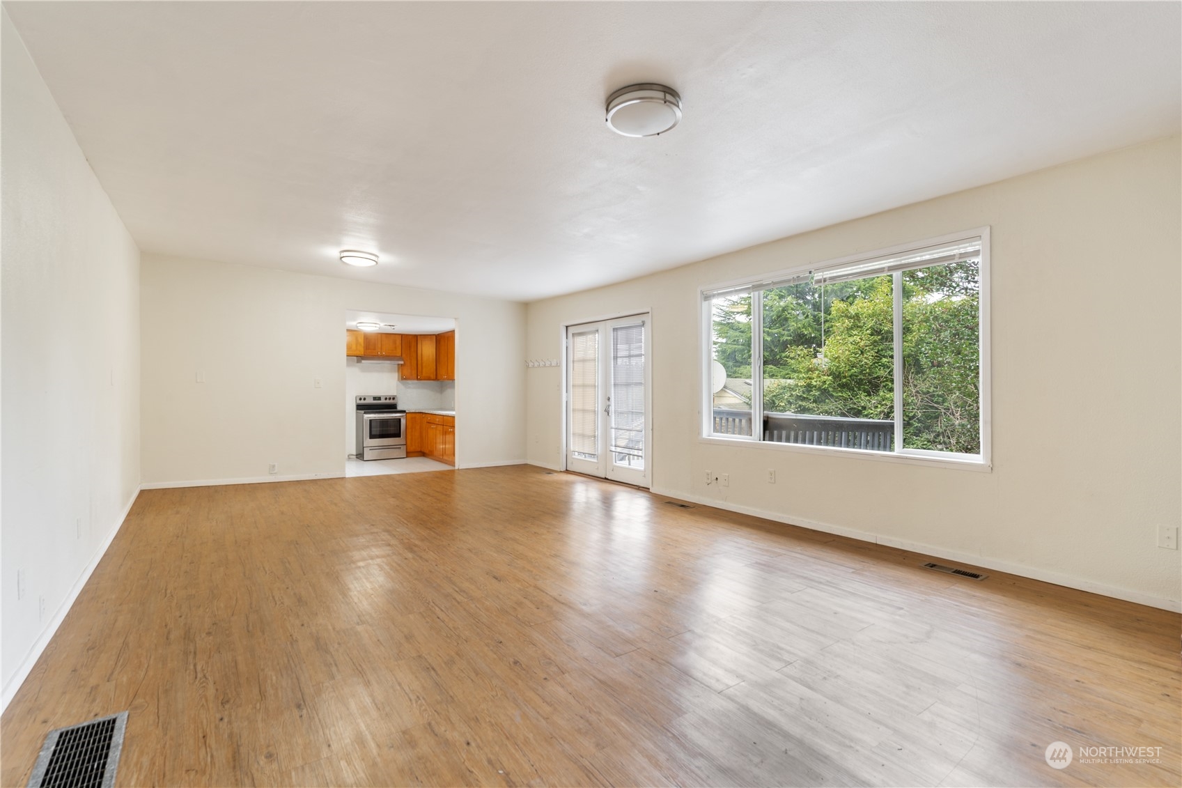 11632 24th Avenue South Seattle, WA 98168 - Photo 8 of 38 a view of empty room with wooden floor and fan