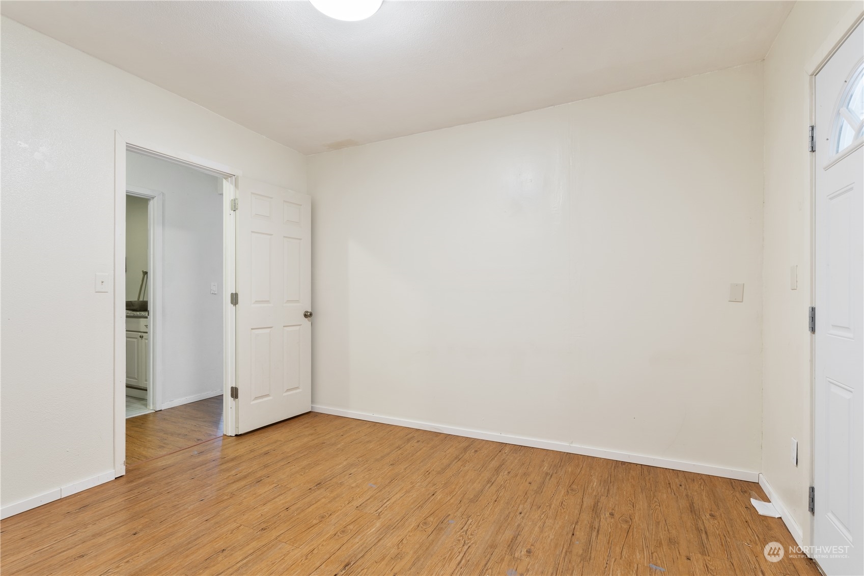 11632 24th Avenue South Seattle, WA 98168 - Photo 10 of 38 a view of an empty room with wooden floor