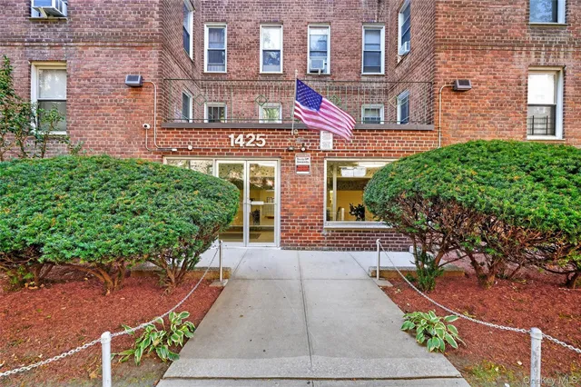 a view of a building with potted plants