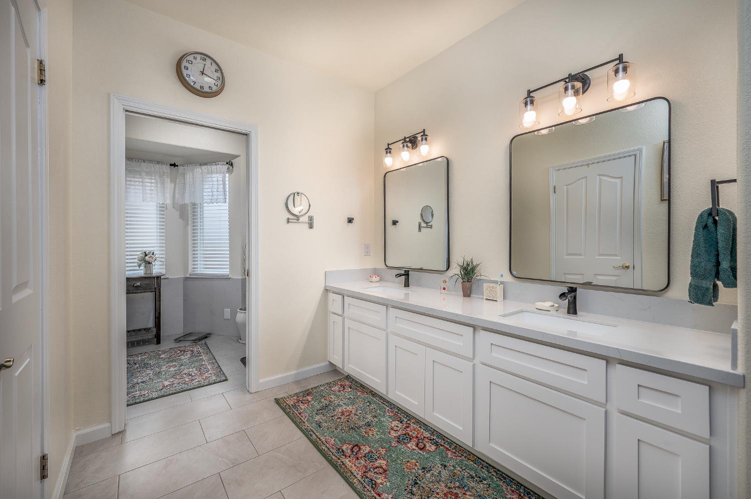 1850 Hammond Drive Turlock, CA 95382 - Photo 27 of 57 a spacious bathroom with a double vanity sink and a mirror