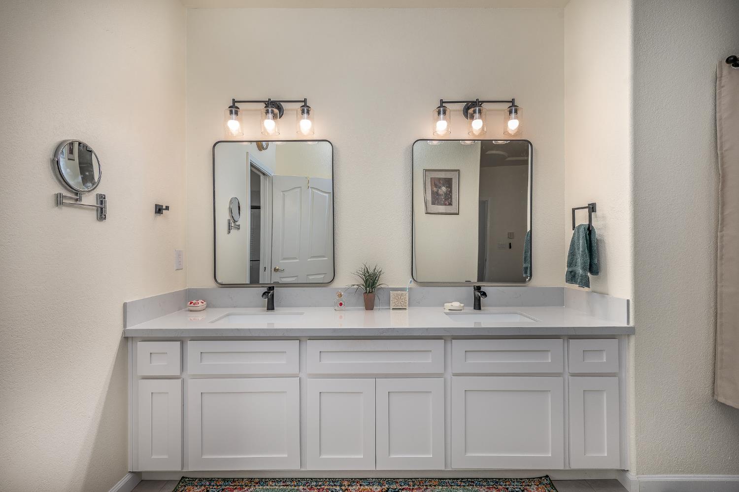 1850 Hammond Drive Turlock, CA 95382 - Photo 28 of 57 a bathroom with double vanity sinks and a mirror