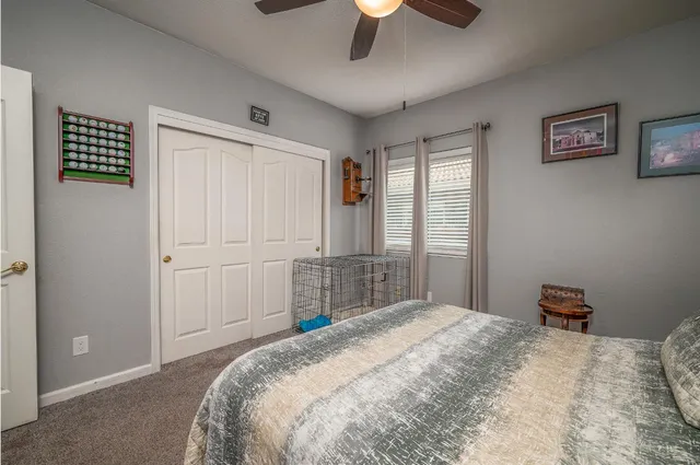 a bedroom with a bed and chair