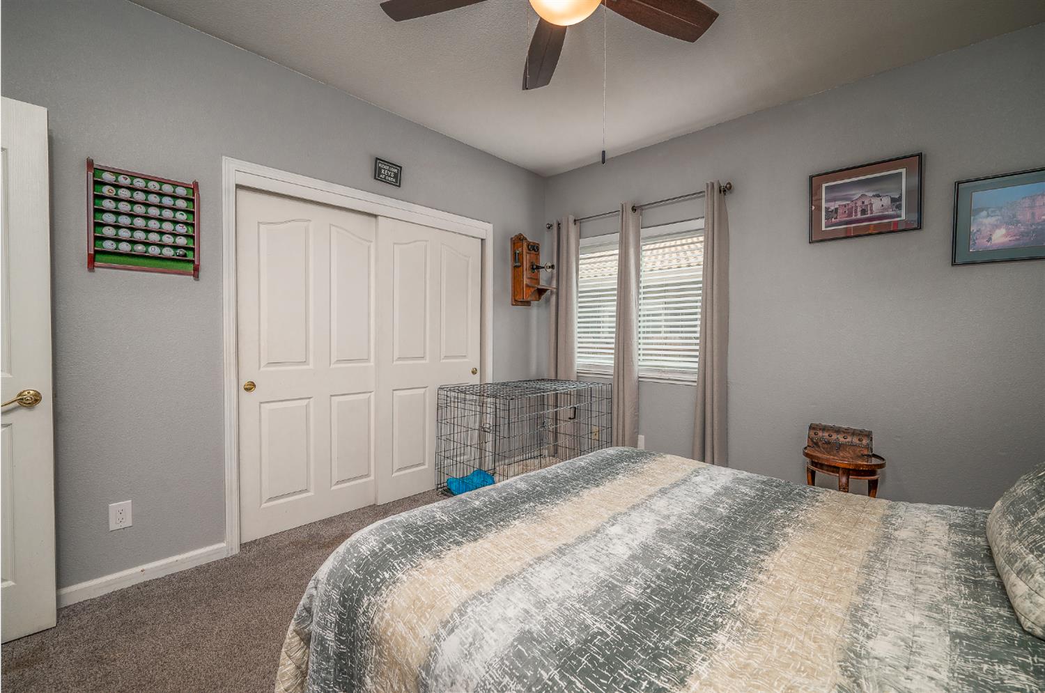 1850 Hammond Drive Turlock, CA 95382 - Photo 32 of 57 a bedroom with a bed and a cabinets