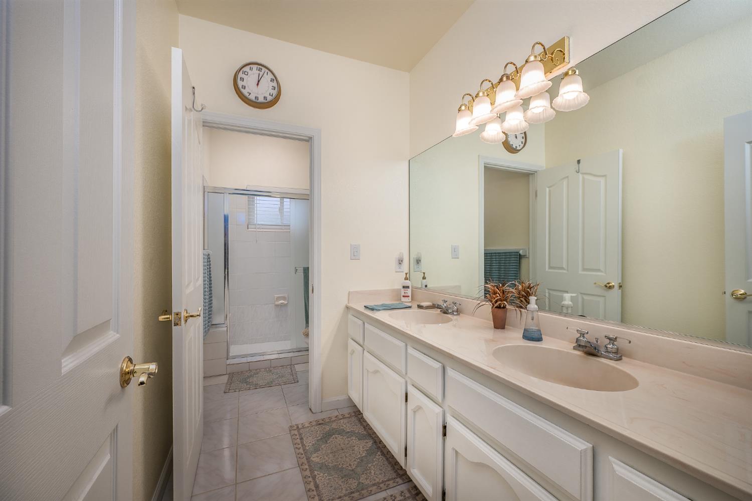 1850 Hammond Drive Turlock, CA 95382 - Photo 33 of 57 a spacious bathroom with a double vanity sink and a mirror
