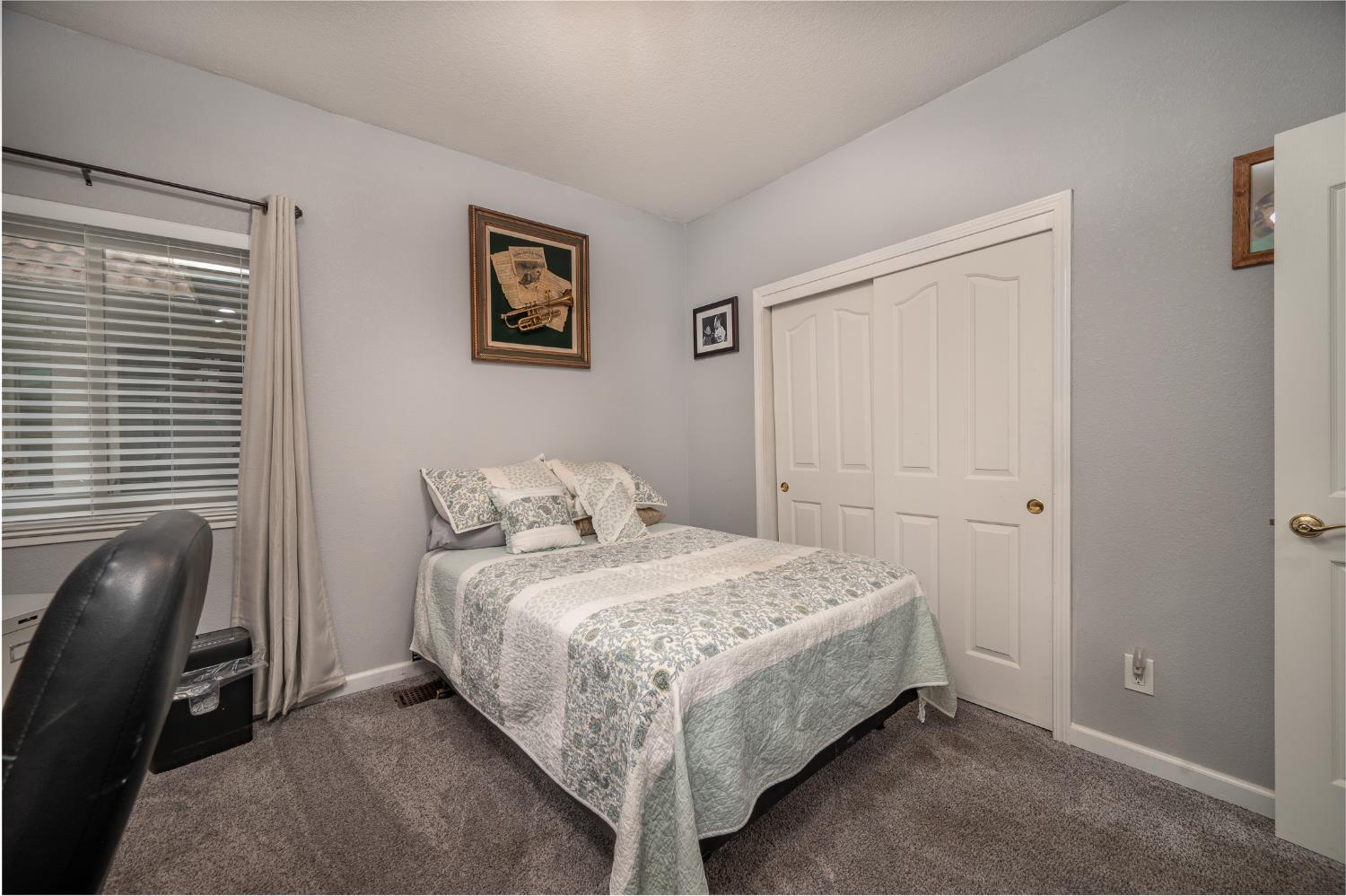 1850 Hammond Drive Turlock, CA 95382 - Photo 35 of 57 a bedroom with a bed and chair
