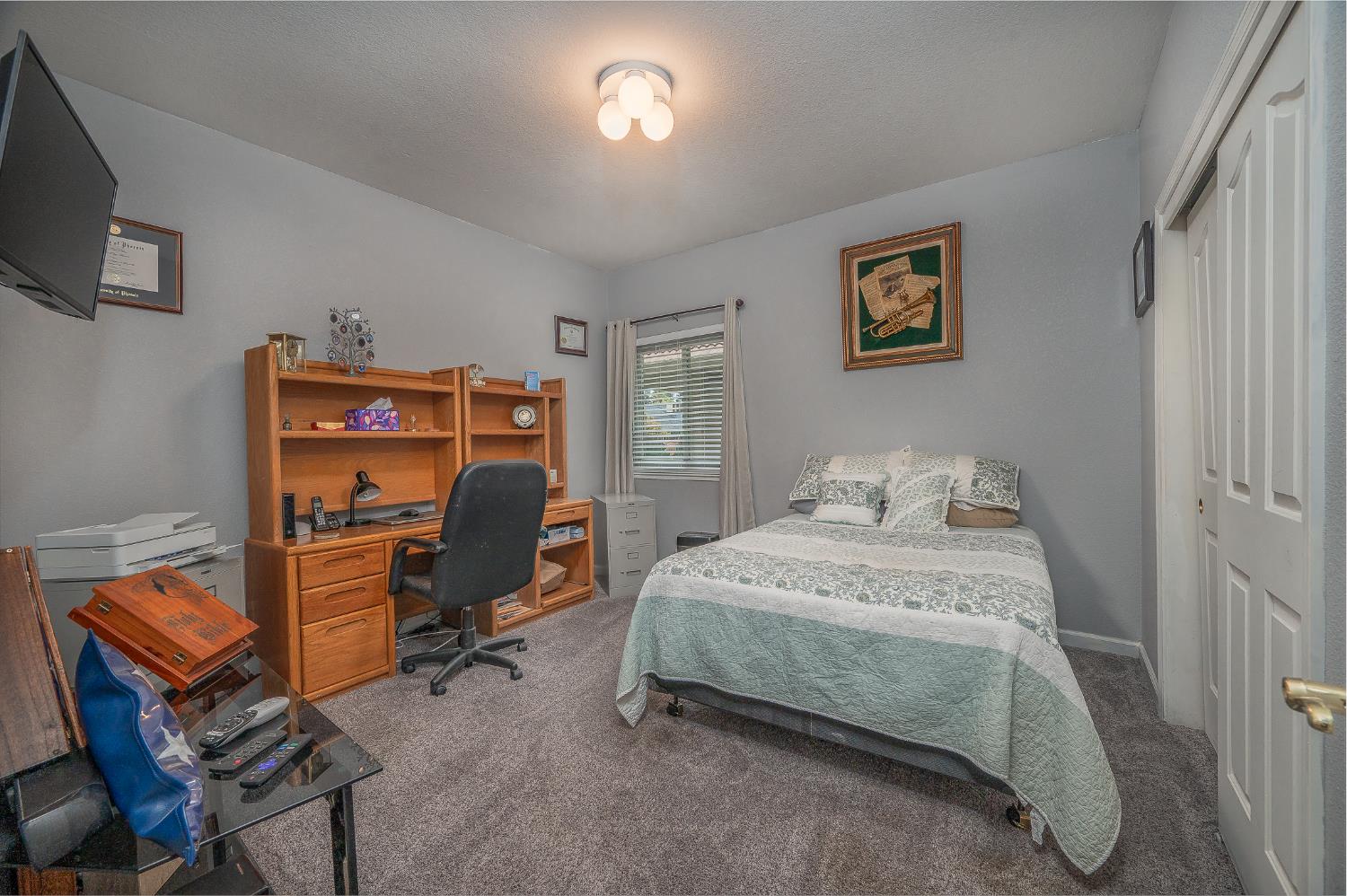 1850 Hammond Drive Turlock, CA 95382 - Photo 36 of 57 a bedroom with bed and a window