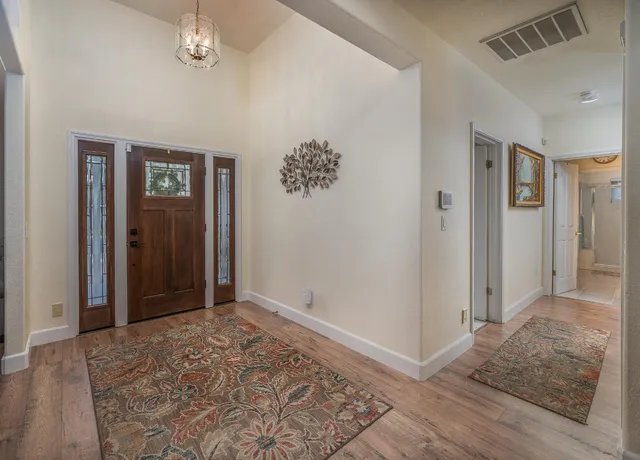 a front view of house with yard and outdoor seating