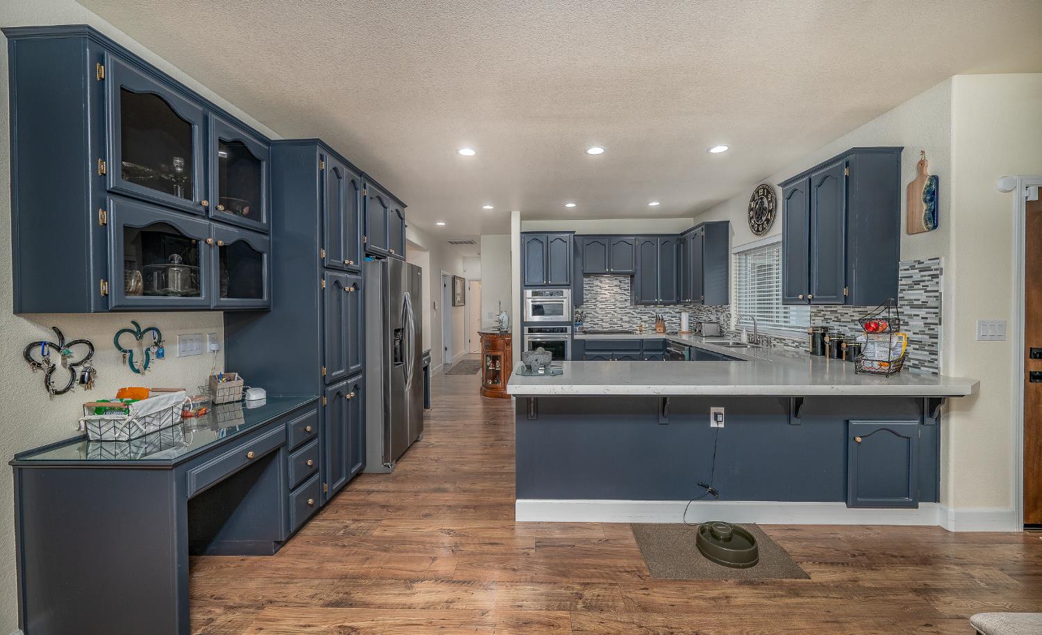 1850 Hammond Drive Turlock, CA 95382 - Photo 4 of 57 a kitchen with stainless steel appliances granite countertop a stove a sink and a refrigerator