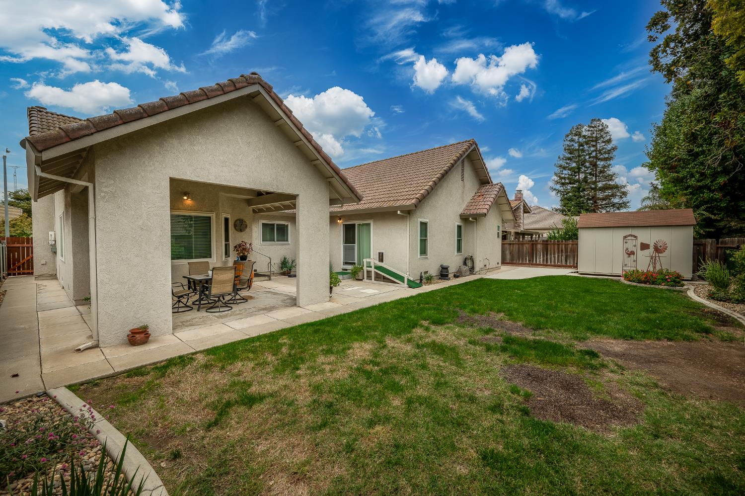 1850 Hammond Drive Turlock, CA 95382 - Photo 46 of 57 a view of a house with backyard porch and sitting area
