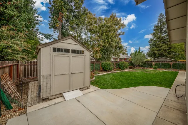 an aerial view of a house with yard