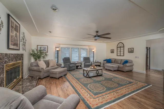 a living room with furniture and a fireplace