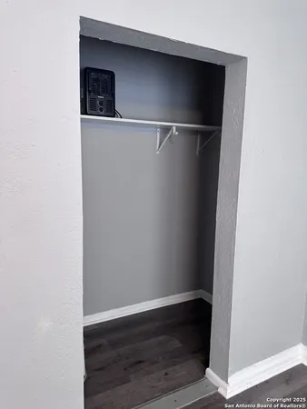 a view of an empty walk in closet
