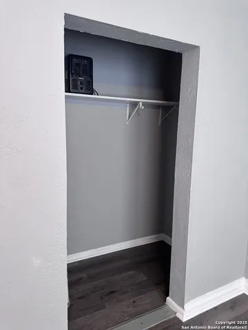 a view of an empty walk in closet