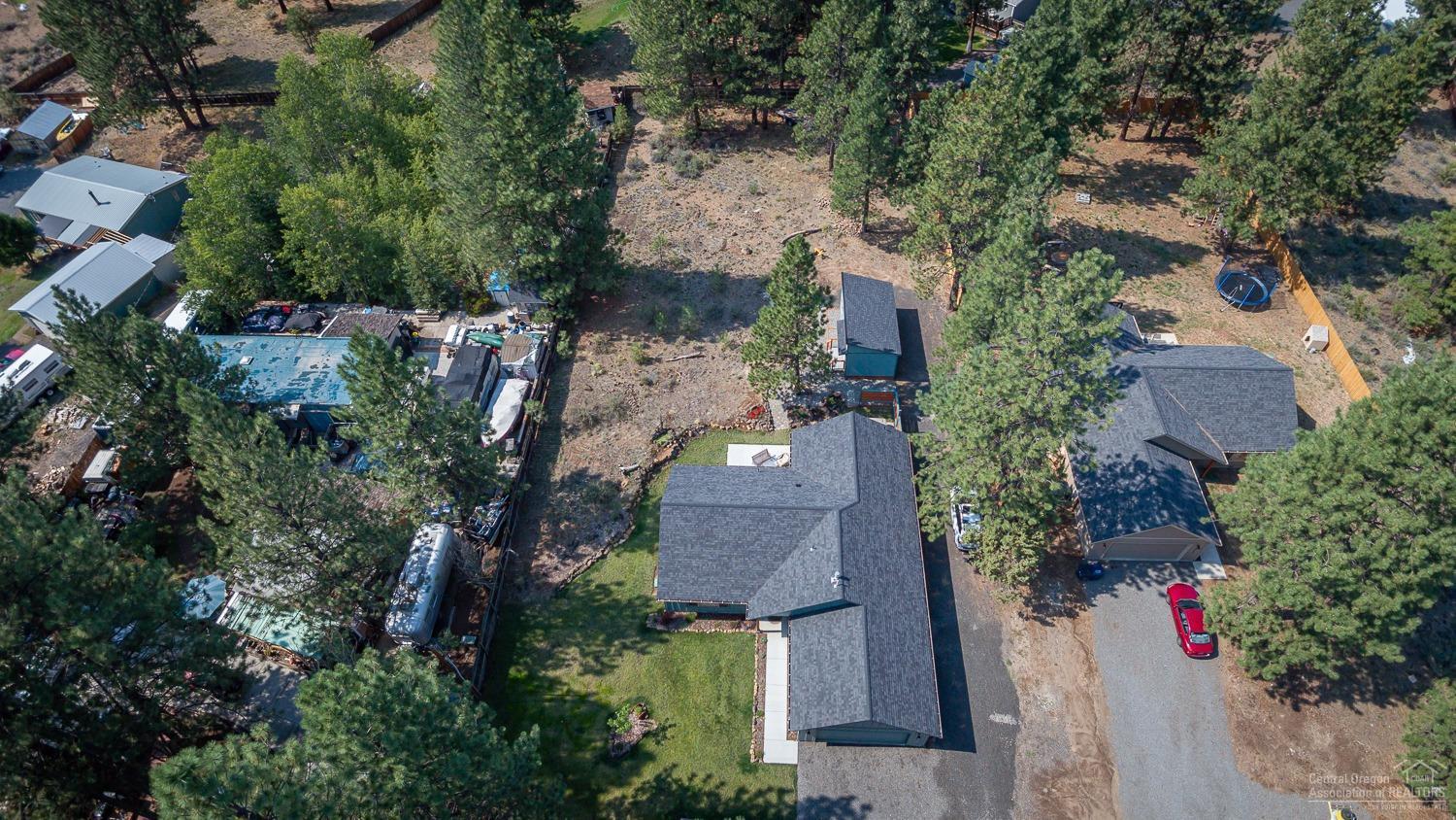 60281 Cheyenne Road Bend, OR 97702 - Photo 5 of 25 View of main home roof, and bonus finish