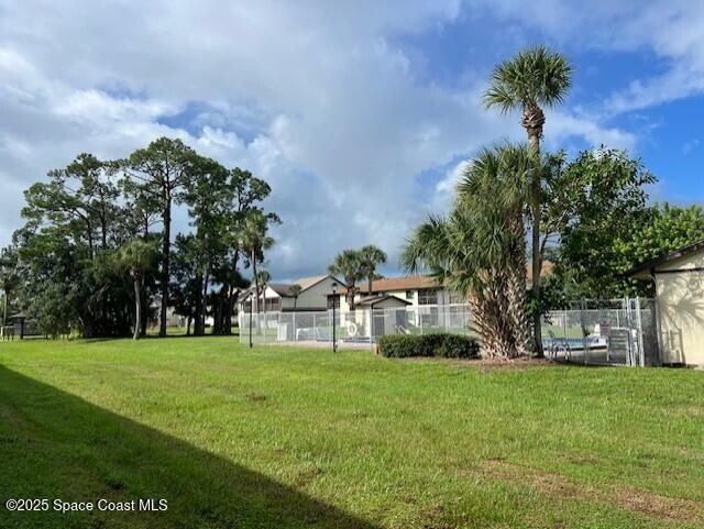 1515 Huntington Lane, Unit 128 Rockledge, FL 32955 - Photo 6 of 7 a house view with a sitting space and garden