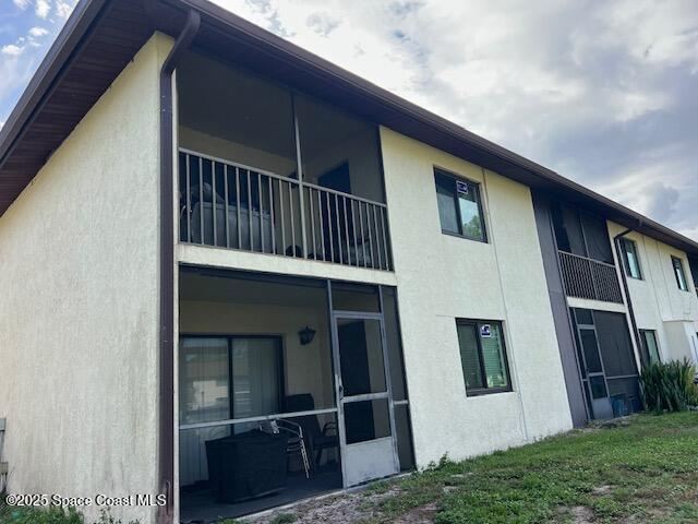 1515 Huntington Lane, Unit 128 Rockledge, FL 32955 - Photo 7 of 7 a view of backyard with deck and wooden floor