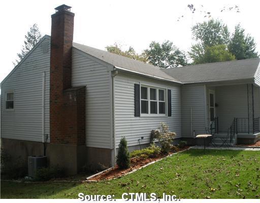 50 Tifton Road Wethersfield, CT 06109 - Photo 1 of 1 a front view of a house with garden
