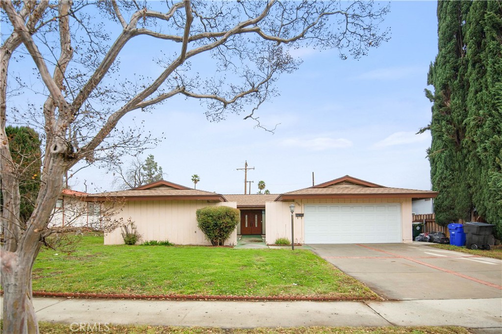 7385 Layton Street Rancho Cucamonga, CA 91730 - Photo 1 of 1 a view of a house with a yard