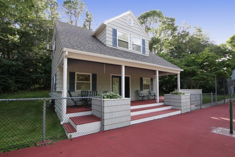 190 Conners Road Centerville, MA 02632 - Photo 18 of 27 a view of a house with a yard and sitting area