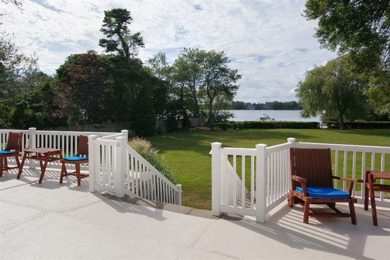 190 Conners Road Centerville, MA 02632 - Photo 22 of 27 a view of a table and chairs on the roof deck