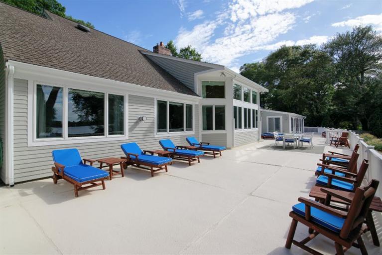 190 Conners Road Centerville, MA 02632 - Photo 23 of 27 a backyard of a house with outdoor seating