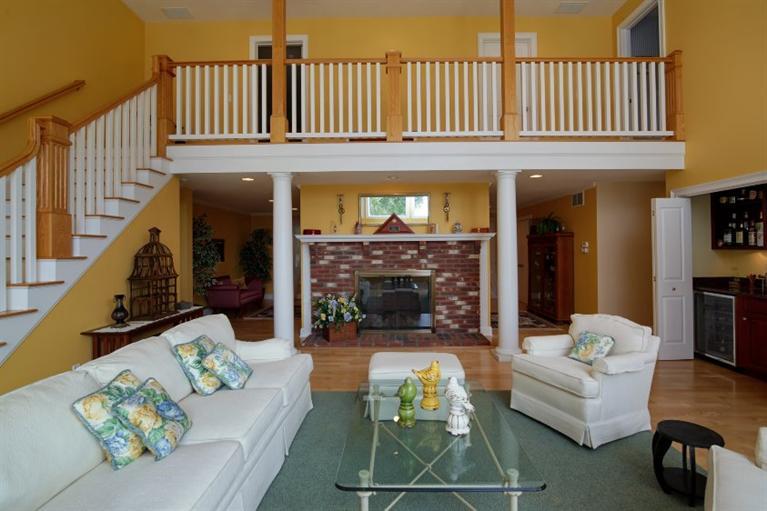 190 Conners Road Centerville, MA 02632 - Photo 5 of 27 a living room with furniture a fireplace and a large window