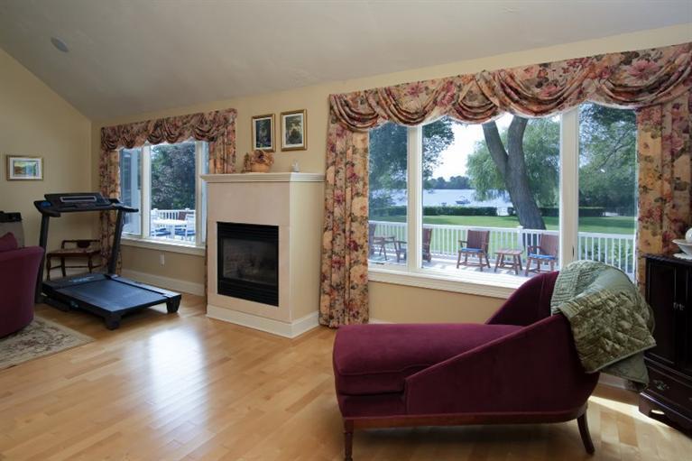 190 Conners Road Centerville, MA 02632 - Photo 10 of 27 a living room with furniture a fireplace and a large window