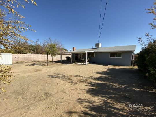 413 Karin Street Ridgecrest, CA 93555 - Photo 20 of 20 a view of a house with a yard