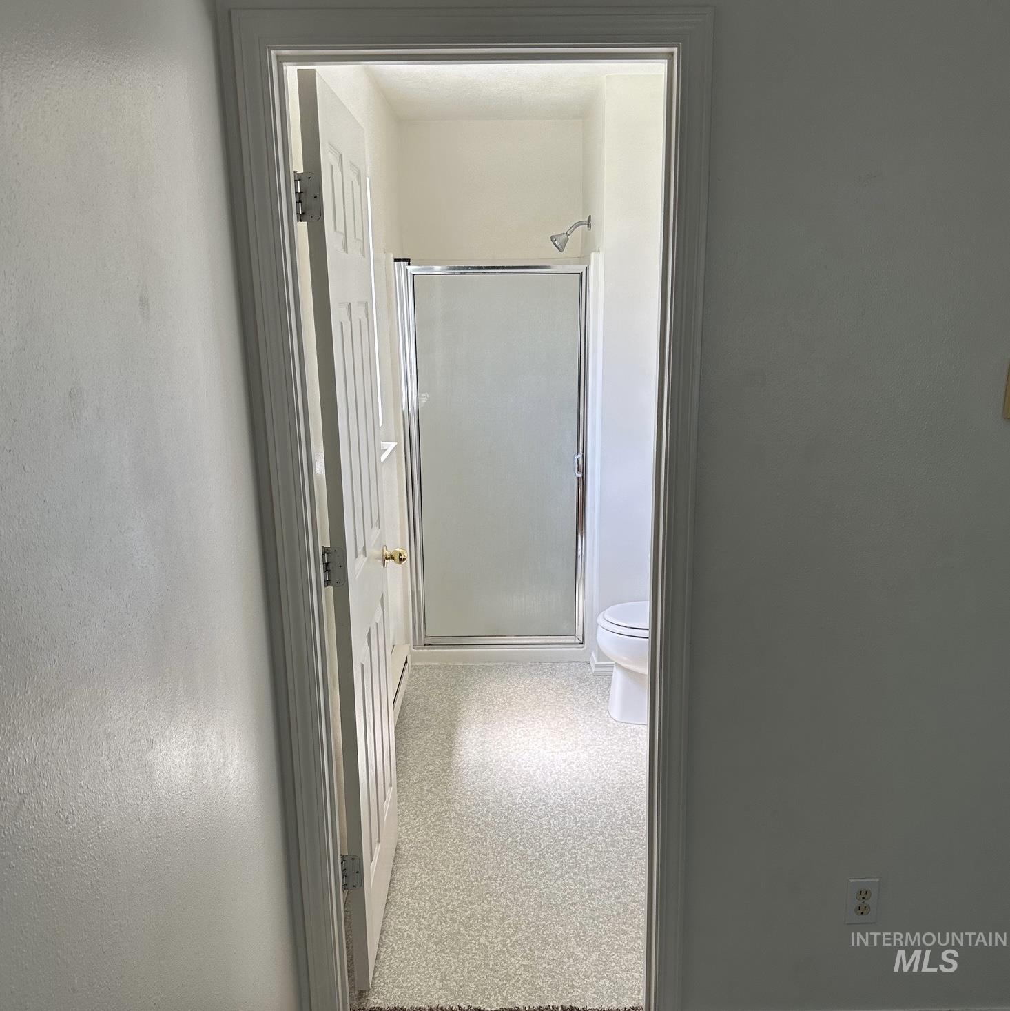 2140 Elizabeth Boulevard Twin Falls, ID 83301 - Photo 7 of 18 Full bathroom with a stall shower and dark aggregate flooring
