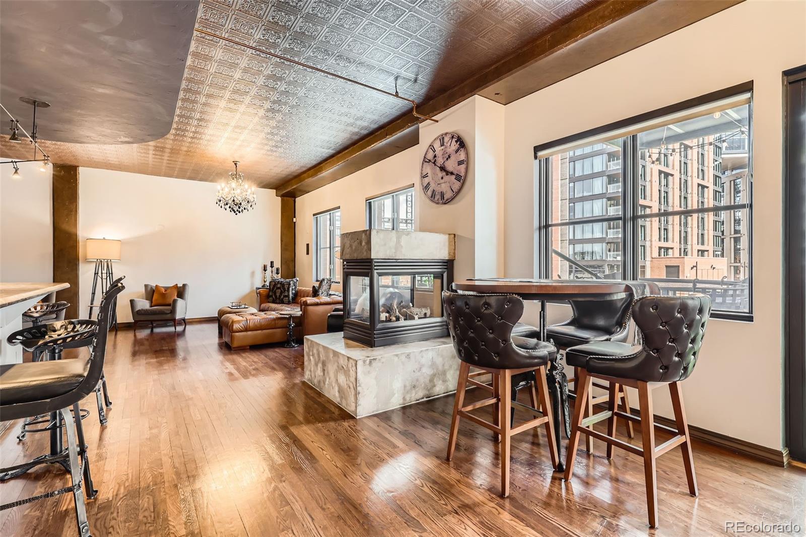 1735 19th Street, Unit 5B Denver, CO 80202 - Photo 14 of 50 a living room with furniture and a wooden floor