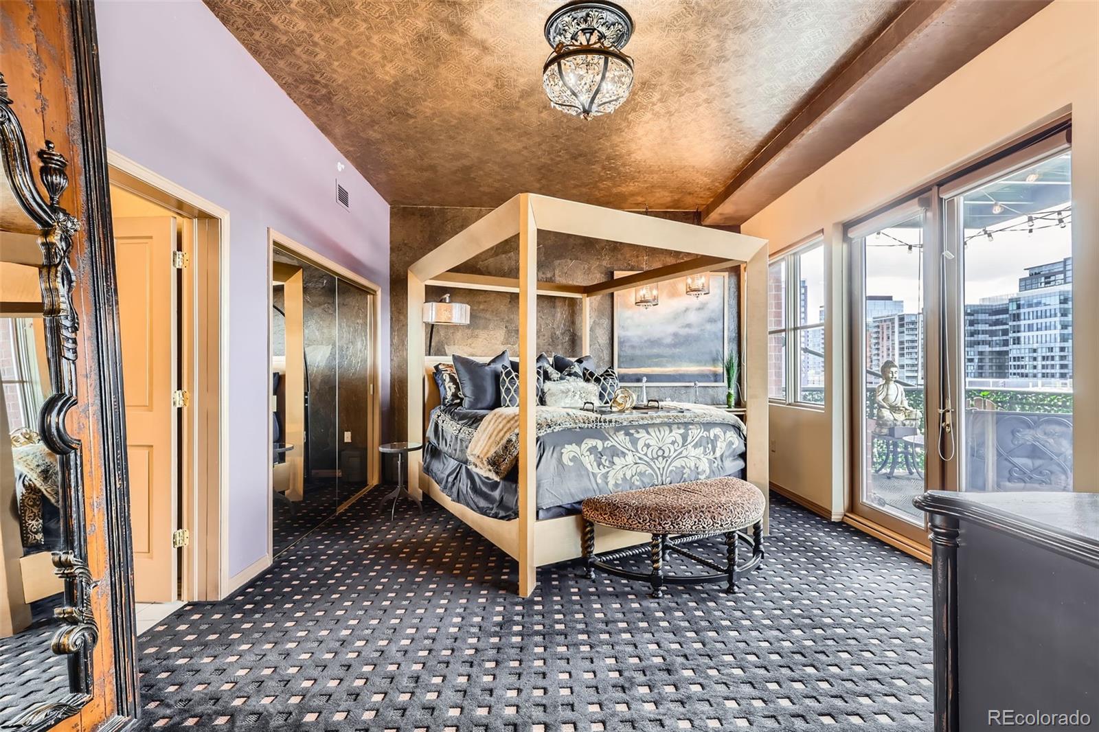 1735 19th Street, Unit 5B Denver, CO 80202 - Photo 17 of 50 a bed sitting in a bedroom next to a window