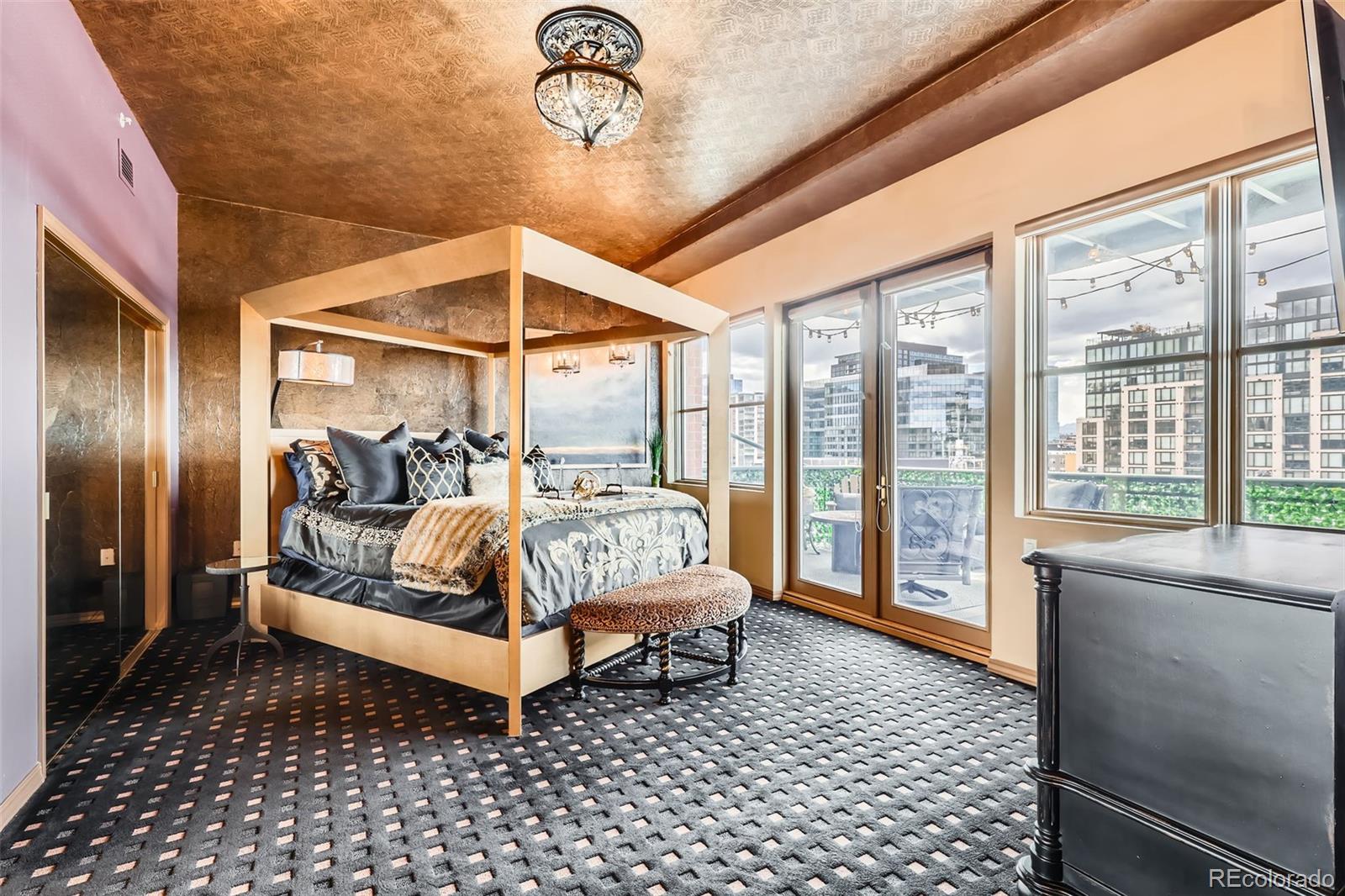 1735 19th Street, Unit 5B Denver, CO 80202 - Photo 18 of 50 a bed room with a bed and a large window