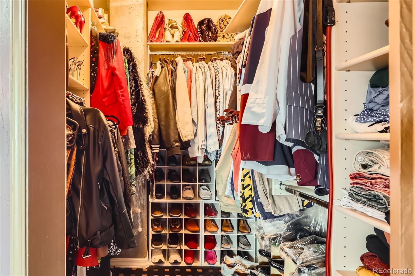 1735 19th Street, Unit 5B Denver, CO 80202 - Photo 23 of 50 a view of walk in closet with clothes and shoes