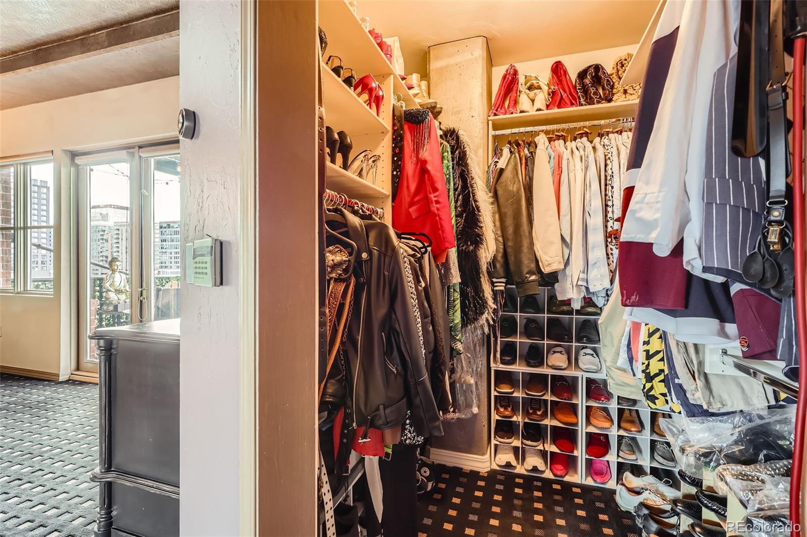 1735 19th Street, Unit 5B Denver, CO 80202 - Photo 24 of 50 a view of walk in closet with clothes and shoes