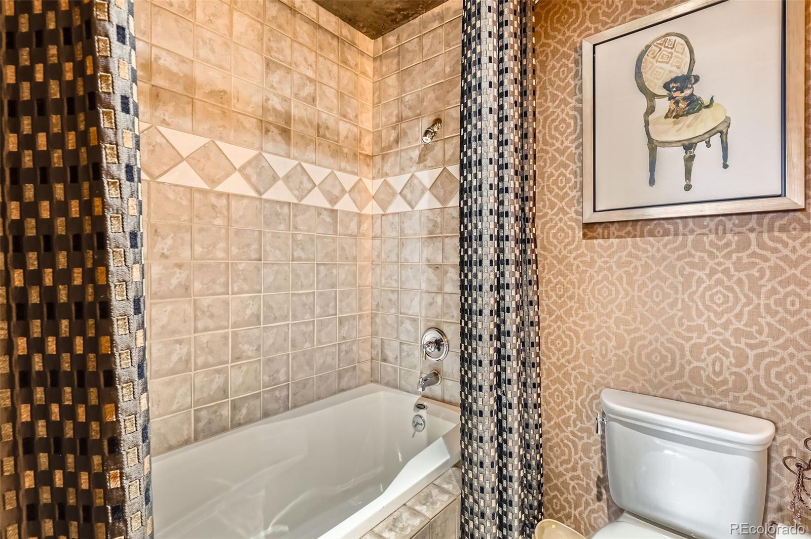 1735 19th Street, Unit 5B Denver, CO 80202 - Photo 30 of 50 a bathroom with a bathtub and shower