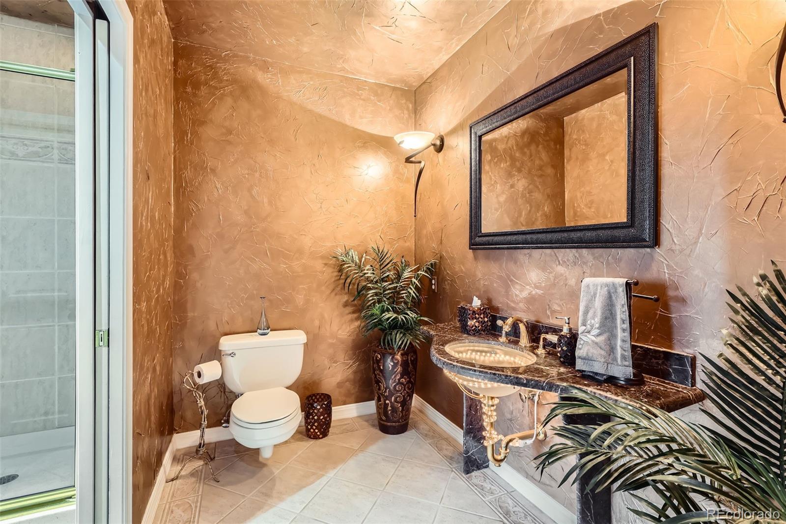 1735 19th Street, Unit 5B Denver, CO 80202 - Photo 34 of 50 a bathroom with a toilet a sink and a mirror