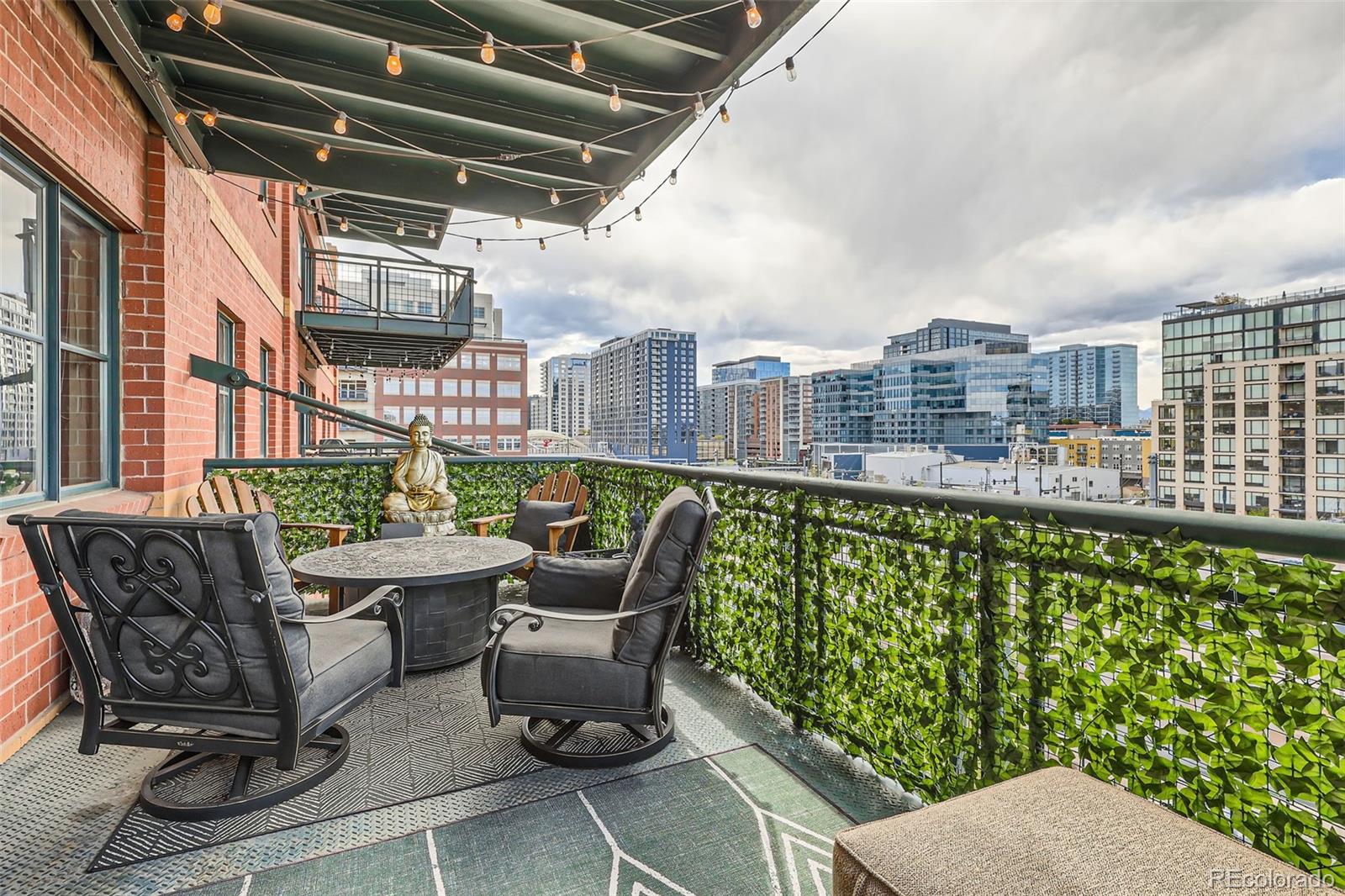 1735 19th Street, Unit 5B Denver, CO 80202 - Photo 37 of 50 a roof deck with couches and potted plants