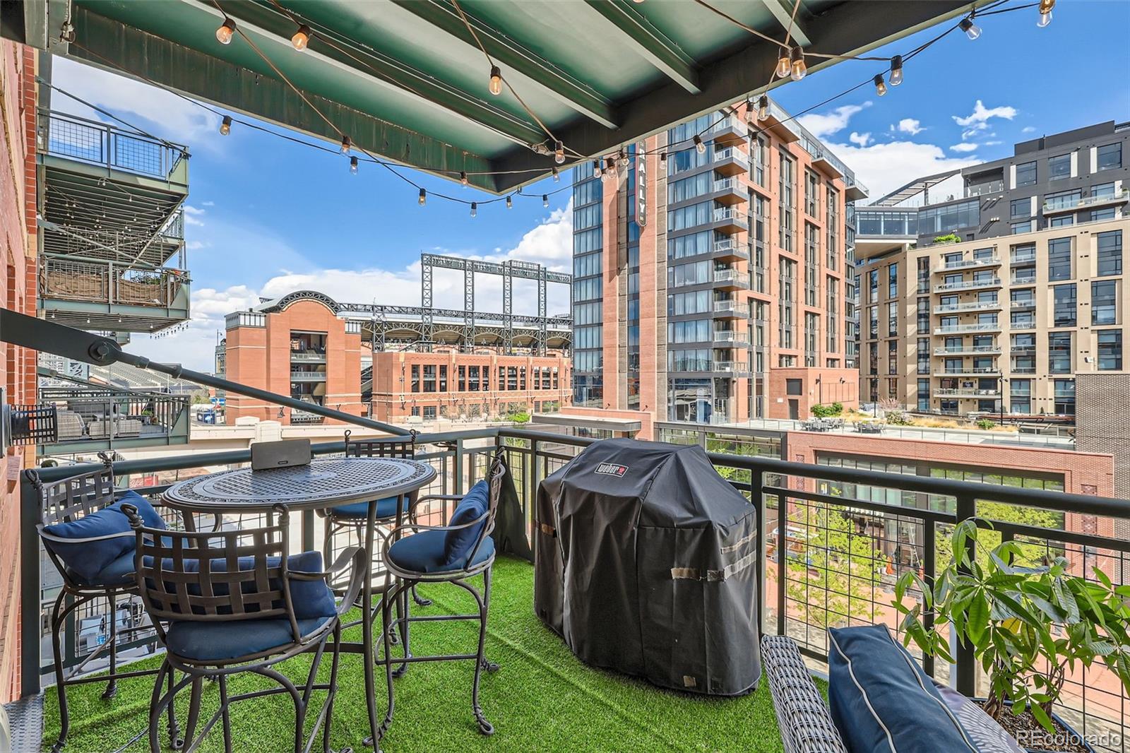 1735 19th Street, Unit 5B Denver, CO 80202 - Photo 40 of 50 a view of a chairs and table in the patio