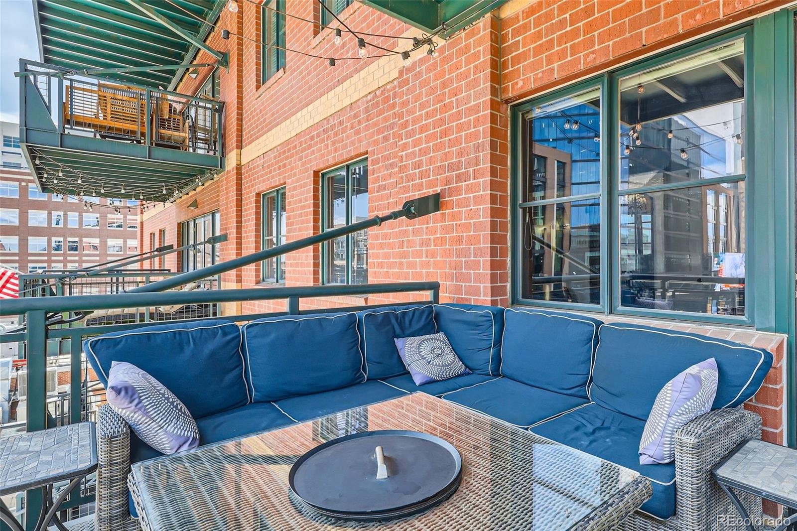 1735 19th Street, Unit 5B Denver, CO 80202 - Photo 41 of 50 a balcony with furniture and window