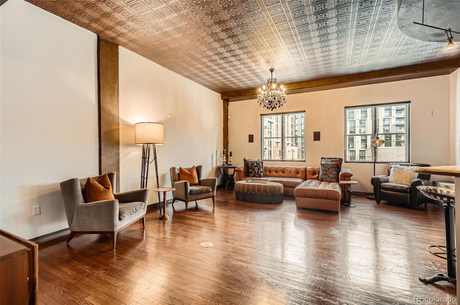 1735 19th Street, Unit 5B Denver, CO 80202 - Photo 10 of 50 a living room with furniture and a wooden floor