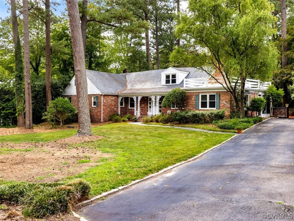 208 Ross Road Henrico, VA 23229 - Photo 1 of 31 a front view of a house with a yard table and chairs