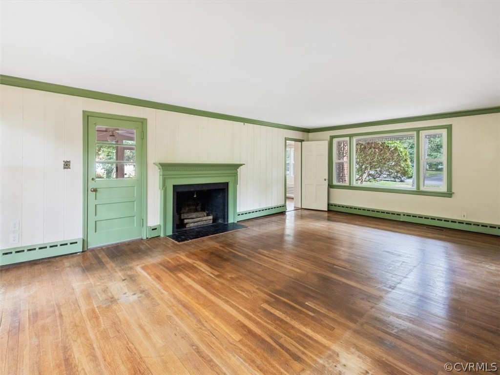 208 Ross Road Henrico, VA 23229 - Photo 13 of 31 wooden floor fireplace and windows in an empty room