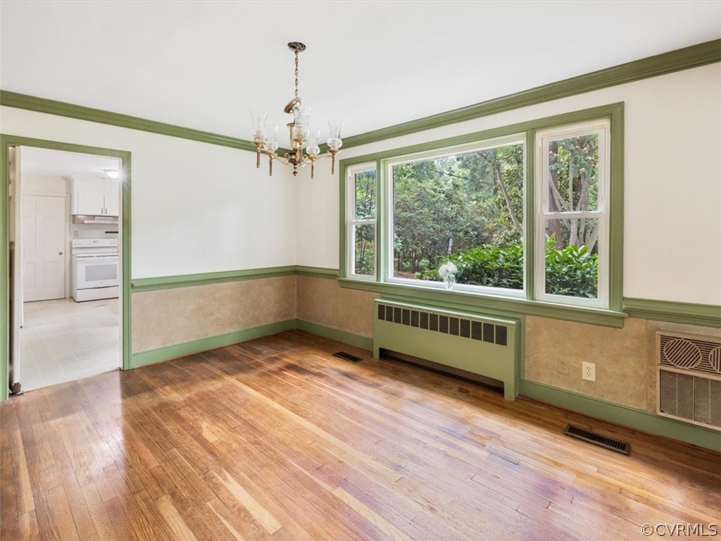 208 Ross Road Henrico, VA 23229 - Photo 14 of 31 a view of an empty room with a window and wooden floor