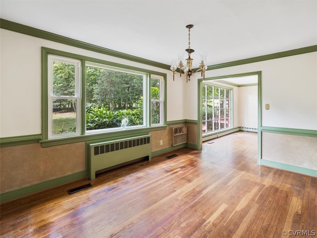 208 Ross Road Henrico, VA 23229 - Photo 15 of 31 wooden floor in an empty room with a window