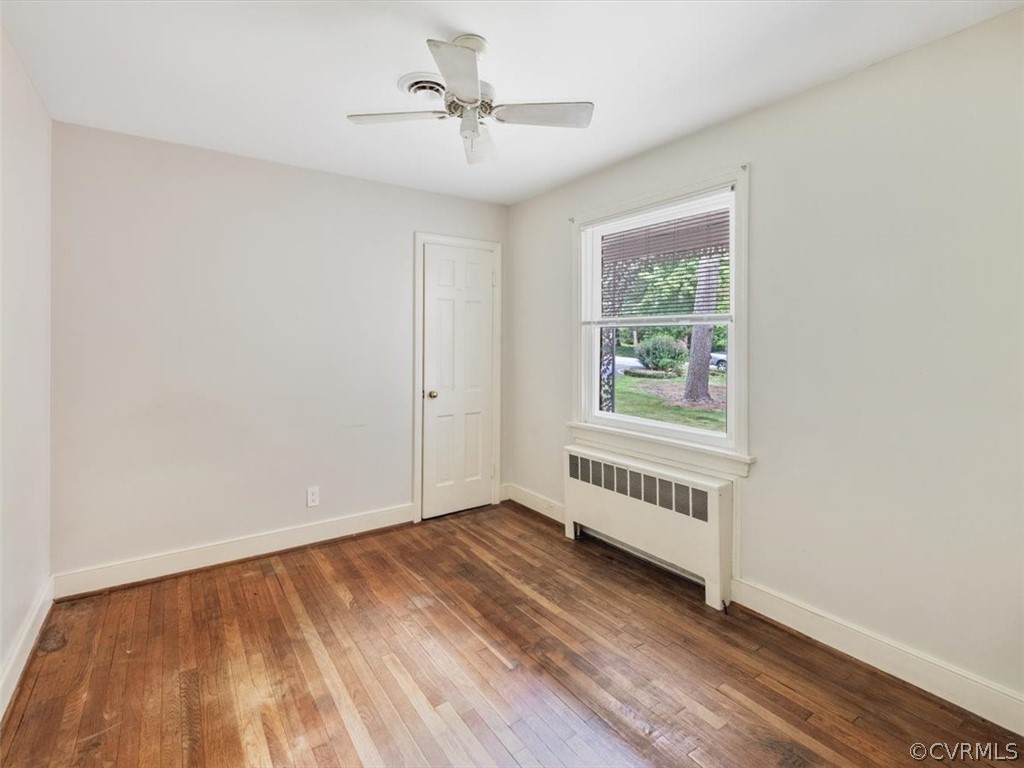 208 Ross Road Henrico, VA 23229 - Photo 18 of 31 a view of an empty room with a window and wooden floor