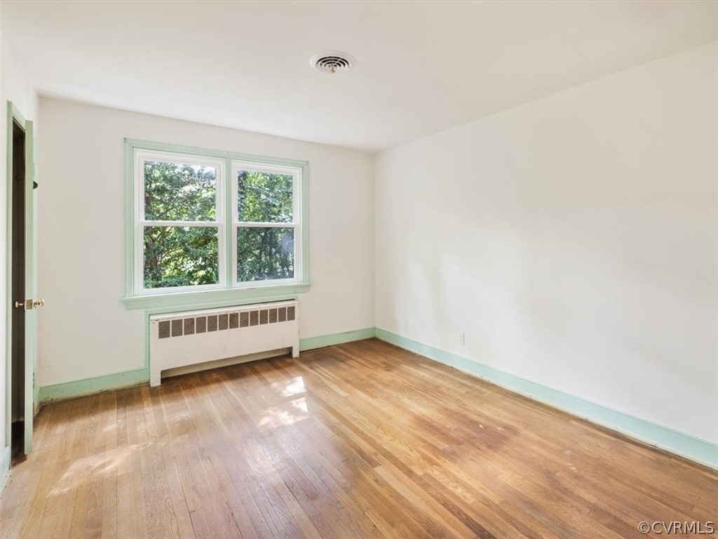 208 Ross Road Henrico, VA 23229 - Photo 20 of 31 an empty room with wooden floor and windows