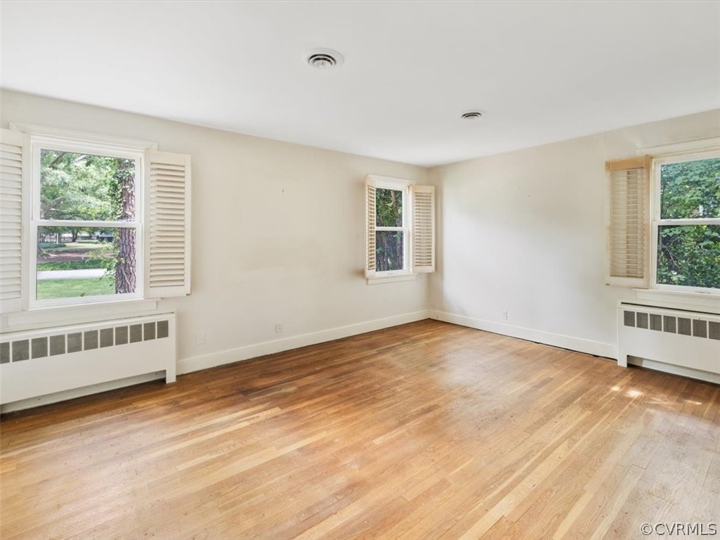 208 Ross Road Henrico, VA 23229 - Photo 21 of 31 a view of an empty room with wooden floor and a window
