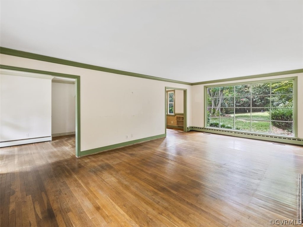 208 Ross Road Henrico, VA 23229 - Photo 8 of 31 an empty room with wooden floor and windows