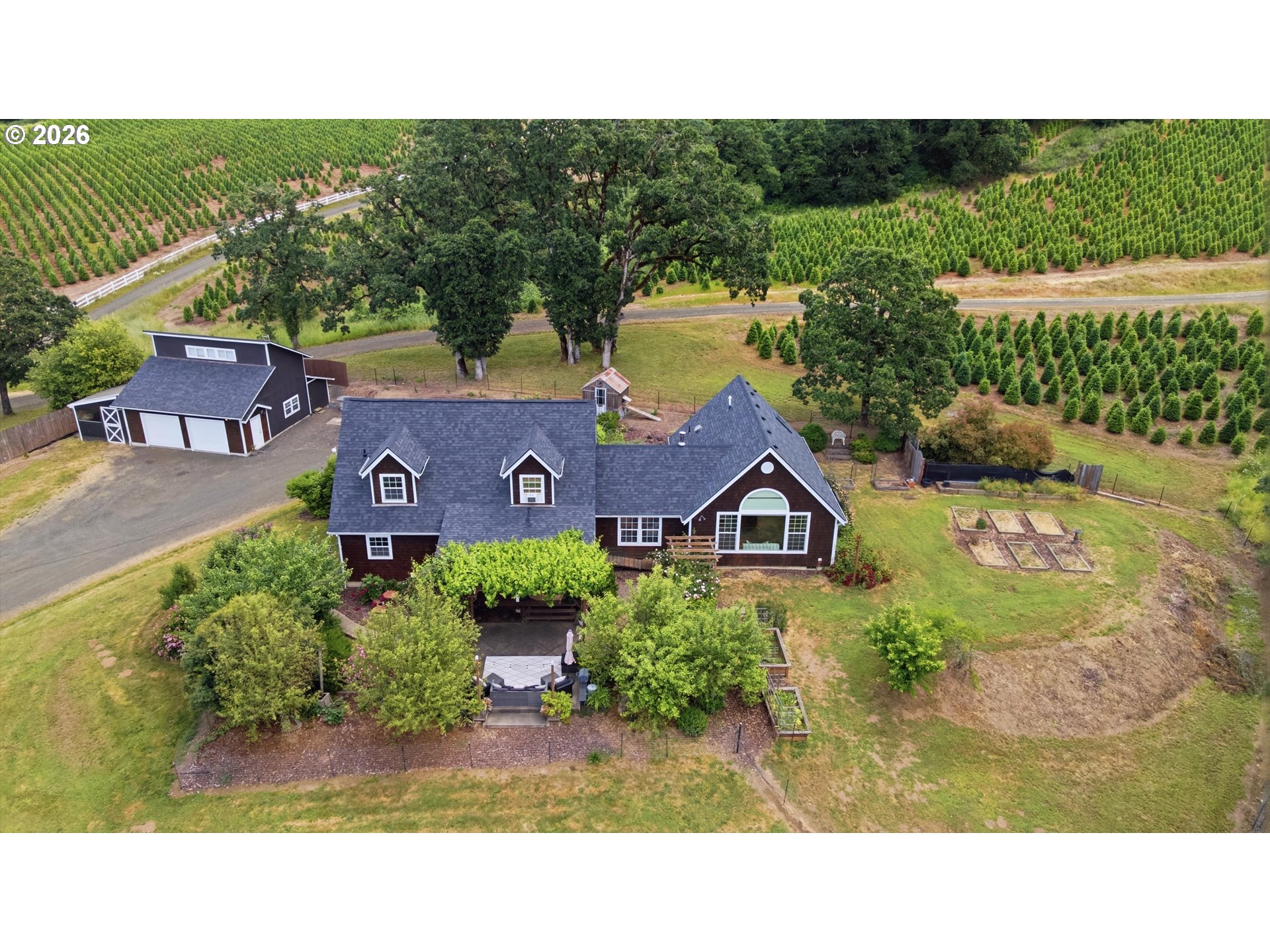 13880 McCaleb Road Monmouth, OR 97361 - Photo 2 of 44 a view of a house with a yard and potted plants