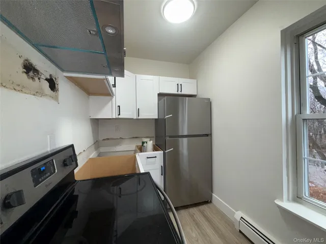 a bed room with a bed and a window